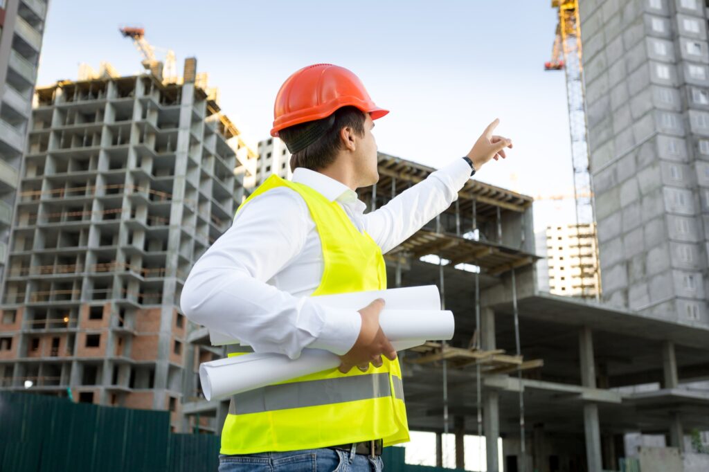 Site manager checking building site under construction